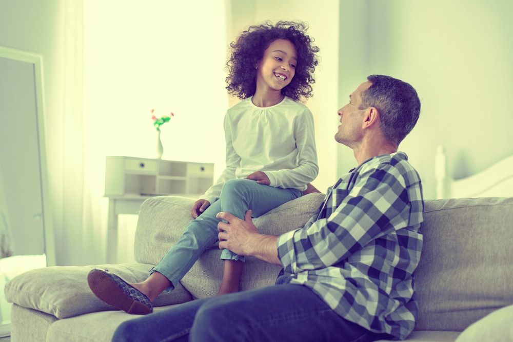 Filing for Child Custody in Los Angeles County California image portrayed by a daughter and her father smiling.